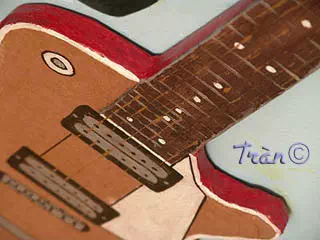 Guitare jouet en carton